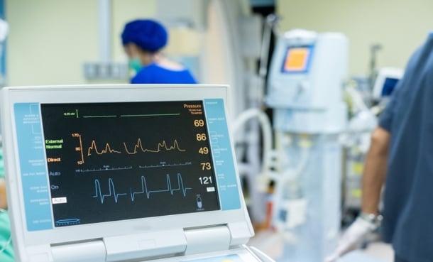 ICU bedside monitor displaying arterial blood pressure trends during post-cardiac arrest care.