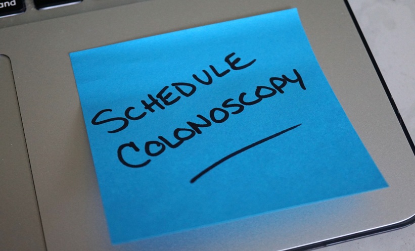 Sticky note reminder for colorectal cancer screening amid Medicaid eligibility restrictions.