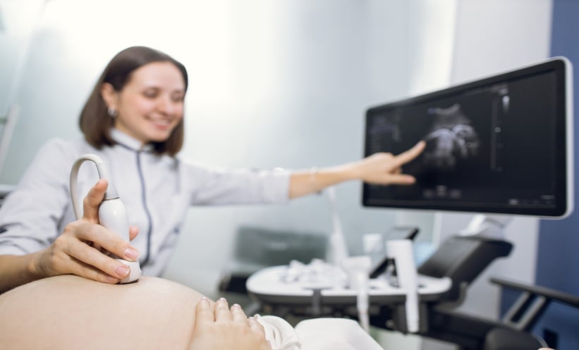 Prenatal ultrasound concept illustrating situs inversus totalis and fetal organ laterality