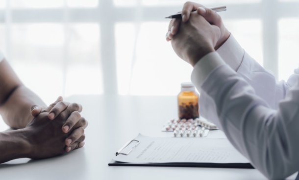 Patient speaking with clinician about long-acting injectable antiretroviral therapy for HIV treatment options.