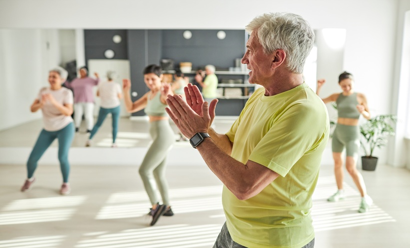 Older adults dancing together in a community class, illustrating how dancing may support brain health and reduce dementia risk.