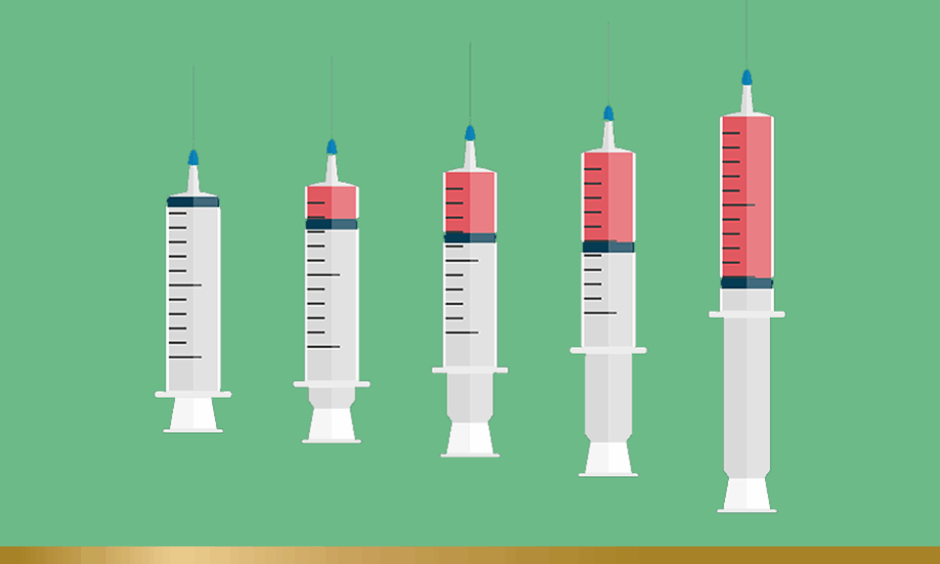 Vaccines on green background