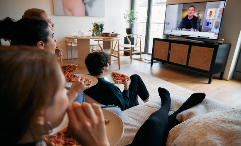 Gen Z college students reviewing HPV vaccination information on a phone and laptop