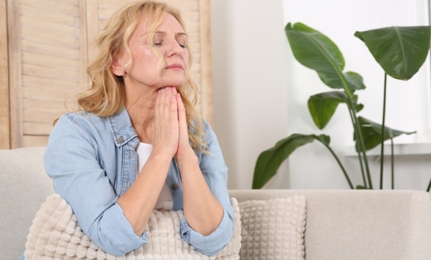 Distressed woman sitting at home.