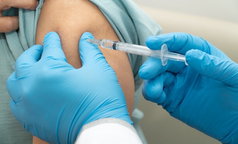 HPV vaccination vial representing global reductions in HPV-related cancer outcomes