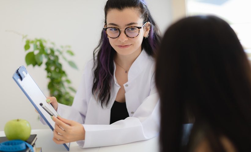 Doctor reviewing latent tuberculosis infection risk factors with a patient who has type 2 diabetes