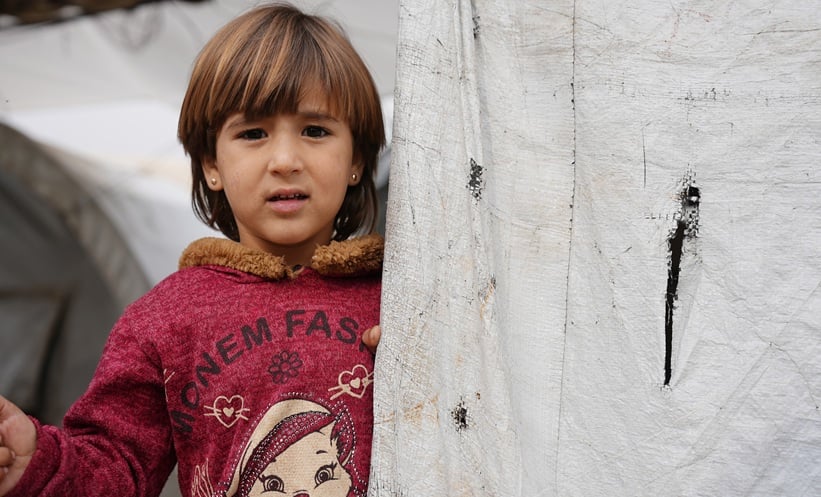 Clinician reviewing cancer care options with displaced patients in a humanitarian setting