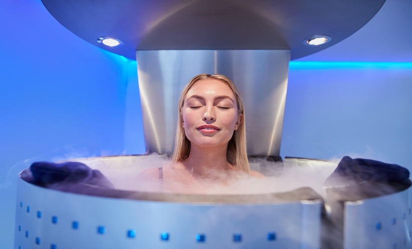 Woman inside a cryotherapy machine.