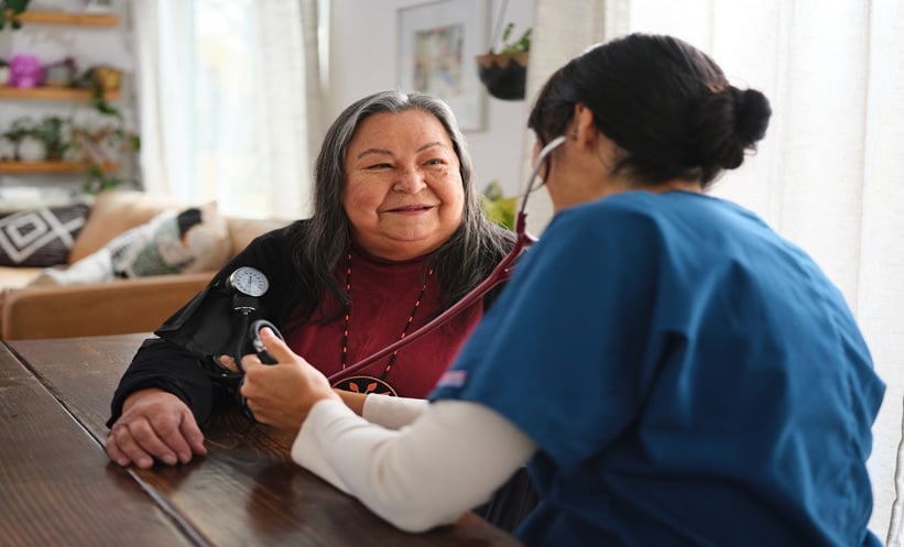 Older adult discussing metastatic NSCLC treatment options with an oncology clinician.