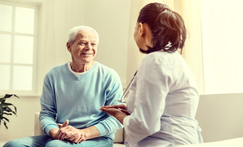 Patient consulting oncologist about head and neck cancer treatment options.