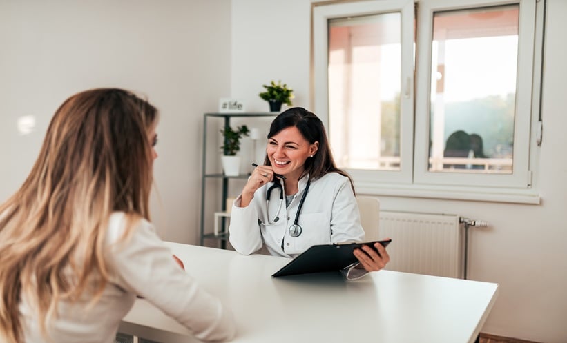 Patient discussing epilepsy self-management with a healthcare professional during a neurology consultation