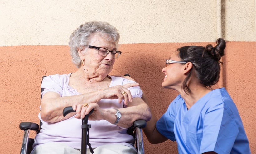 Person with Parkinson’s disease discussing daily life after deep brain stimulation with a clinician.