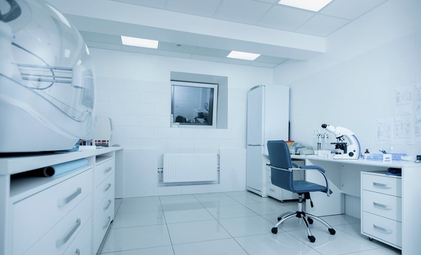 Scientist reviewing antimicrobial resistance data in a clinical laboratory