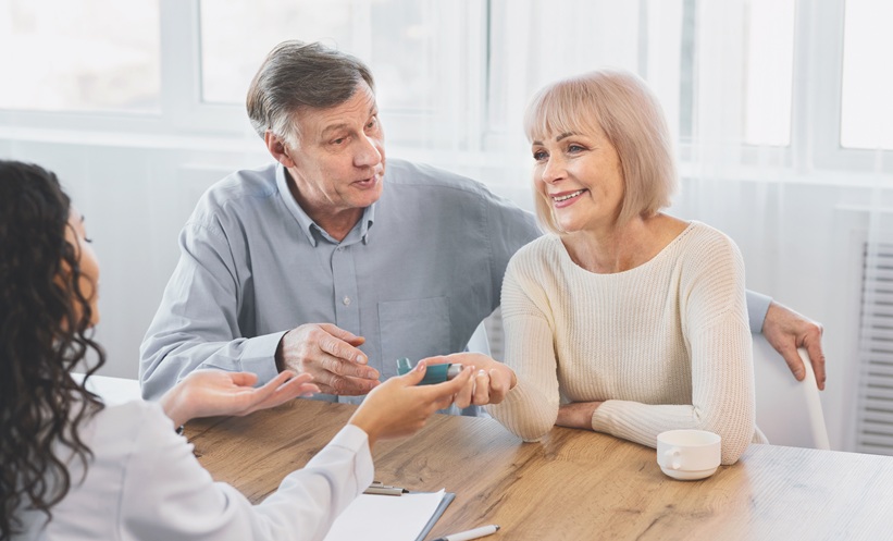 Patient with asthma using an inhaler, representing gabapentinoids and asthma exacerbation risk.