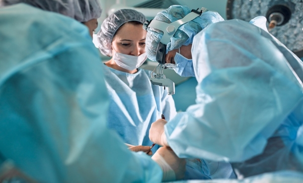 Neurosurgical team performing brain tumor surgery for insular gliomas in an operating room.