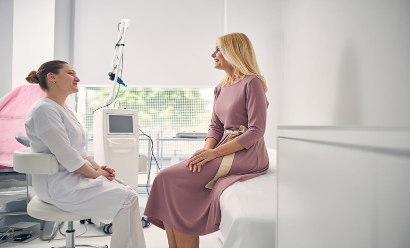 Female patient discussing ADHD reproductive health symptoms with a clinician