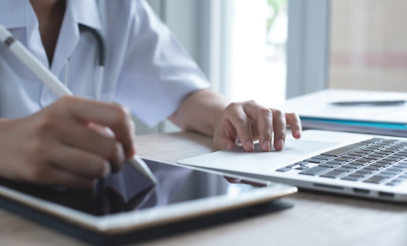 Healthcare professional using an electronic medical record alert to support chlamydia screening in primary care.