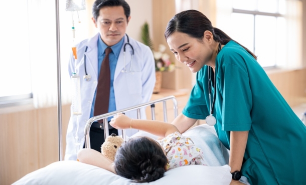Healthcare professionals caring for a hospitalized child receiving treatment for a multidrug-resistant infection.