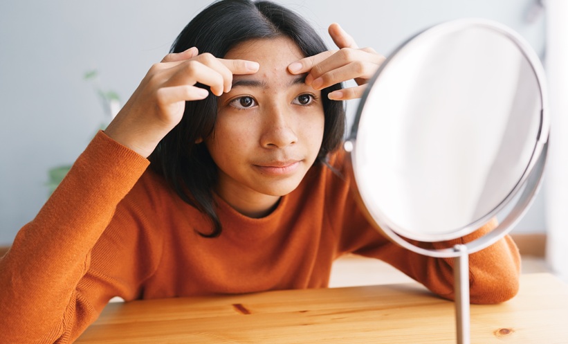 Healthcare professional examining a child’s skin during a pediatric dermatology consultation