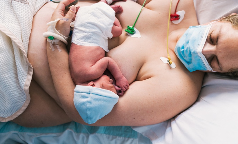 Pregnant patient discussing maternal RSV vaccination with a healthcare professional.