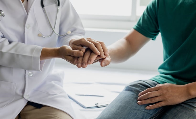 Doctor discussing TALAPRO-3 prostate cancer treatment options with a patient.