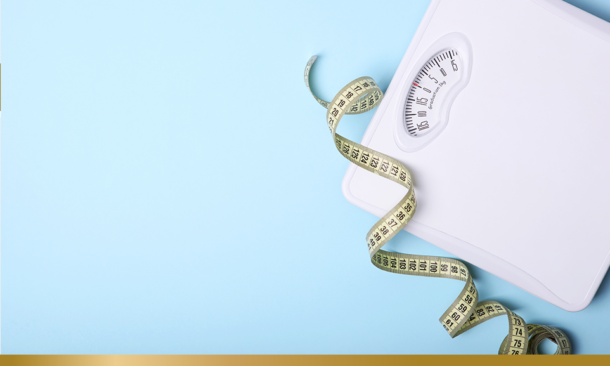 Scales and a tape measure on a blue background