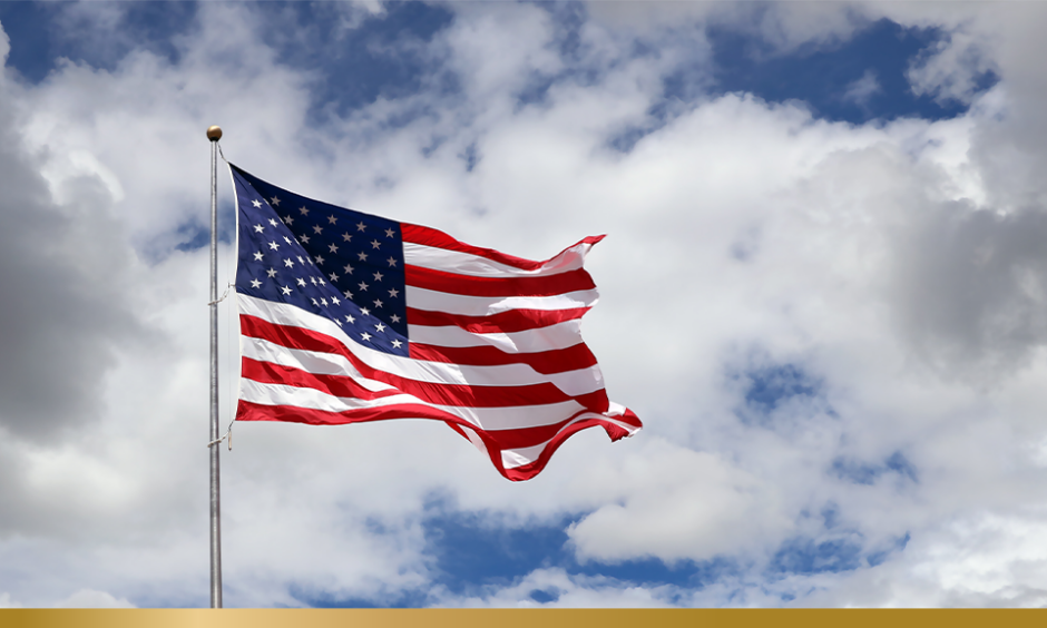 US flag against blue sky