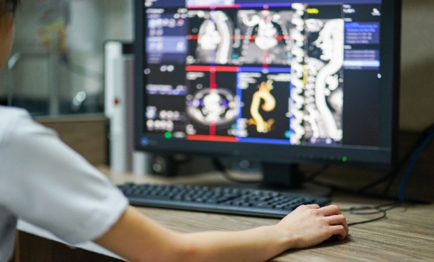 Radiologist reviewing images at desk