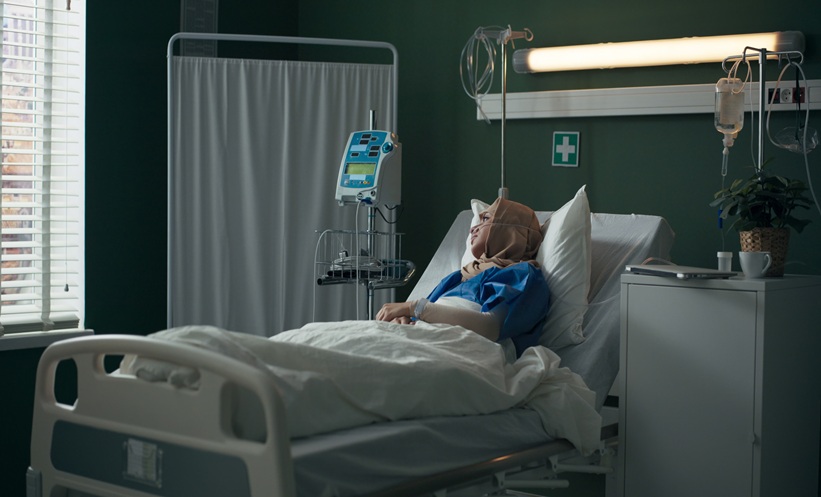 Hospitalized patient receiving supportive care during thoracic cancer treatment.