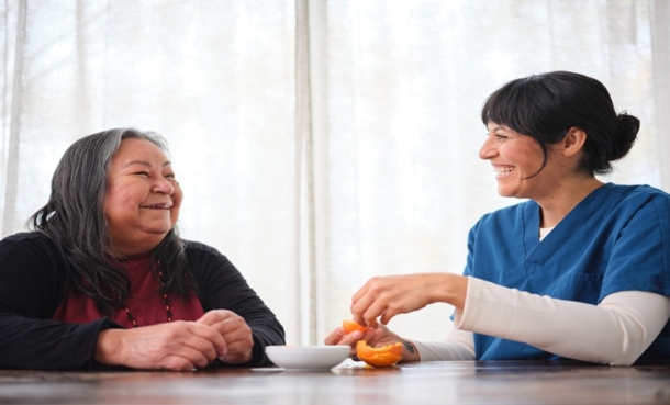 Physician reviewing Alzheimer’s disease diagnosis and dementia imaging with an older adult patient.