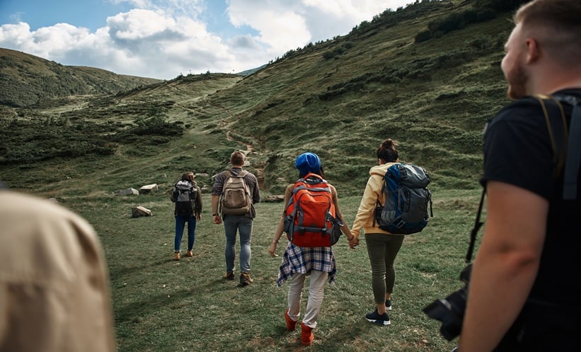 adults walking outdoors, representing daily steps and cognitive health in aging.