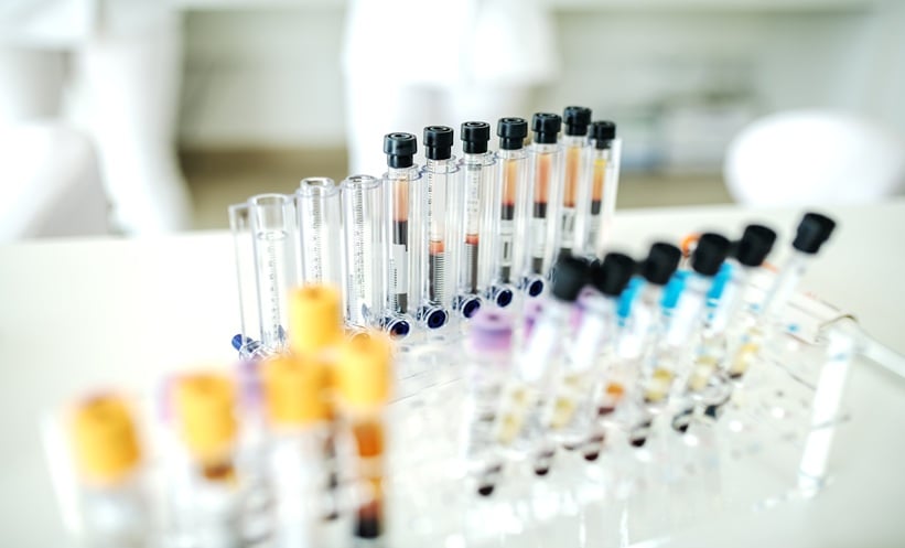 Physician reviewing blood cancer data with patient, reflecting survival disparities in Indigenous populations.