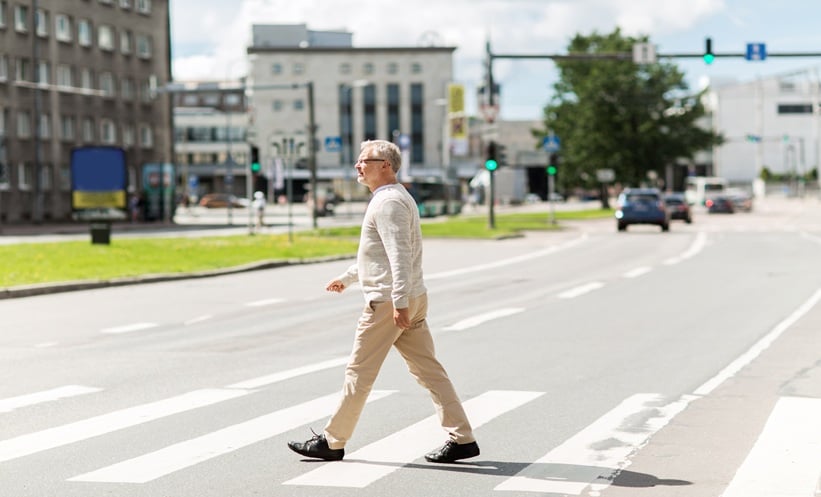Older adult with COPD walking in an urban area affected by traffic-related air pollution