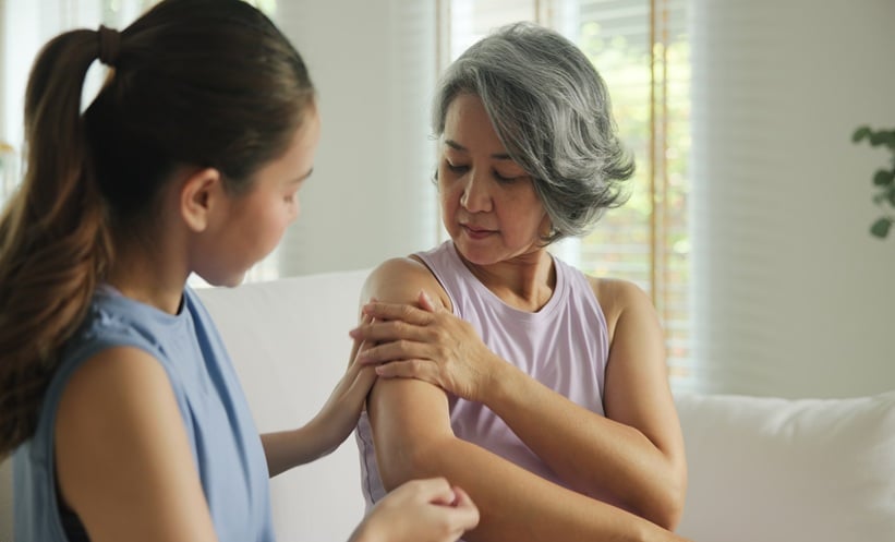Adult applying ruxolitinib cream for moderate atopic dermatitis and persistent dry, itchy skin.