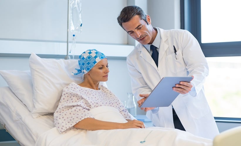 Doctor speaking with cancer patient