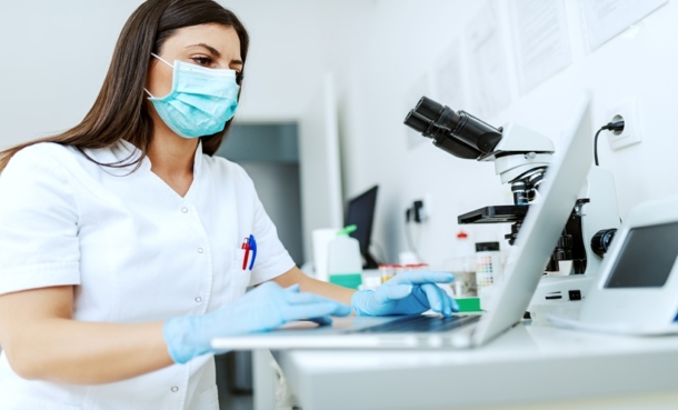 Healthcare professional reviewing hepatitis C care cascade data and follow-up RNA testing results.