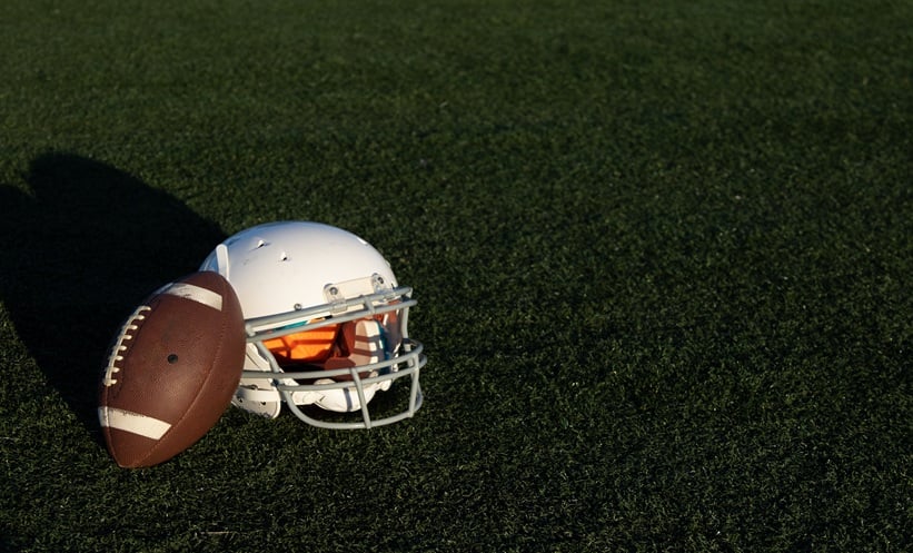 american football helmet on grass
