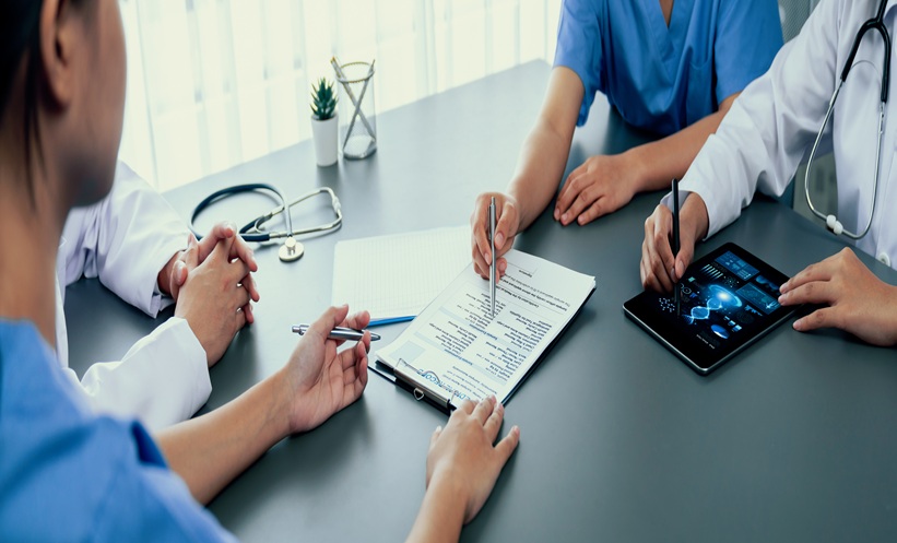 Group of doctor or researcher studying genetic disease with patient