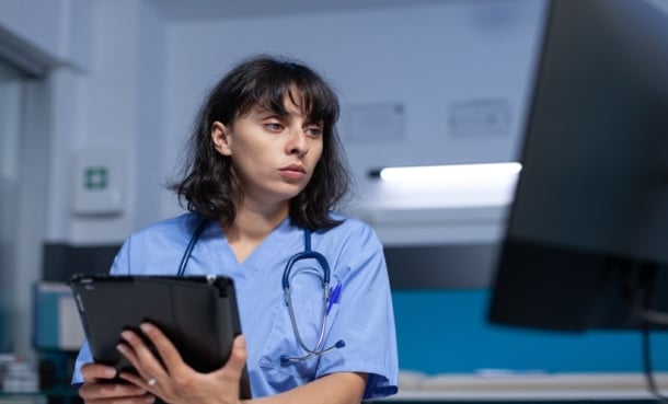 Healthcare shift worker resting, illustrating sleep quality and respiratory infection susceptibility.