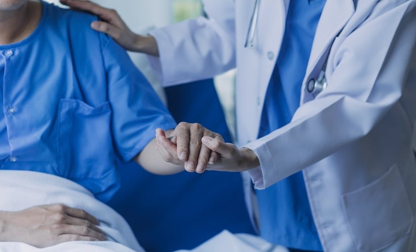 Oncologist reviewing treatment options including atezolizumab for extensive-stage small cell lung cancer.