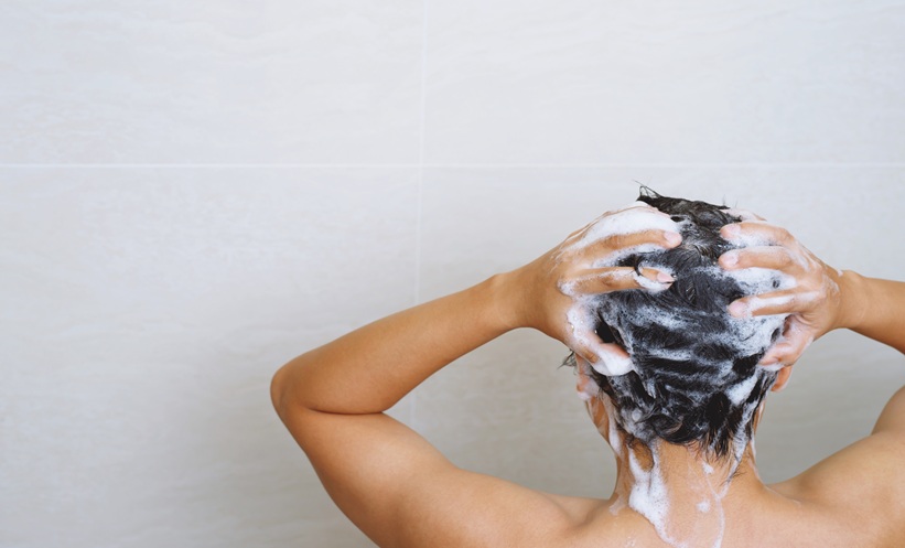 Close-up of scalp and hair representing high scalp sebum, hydration, and skin barrier health