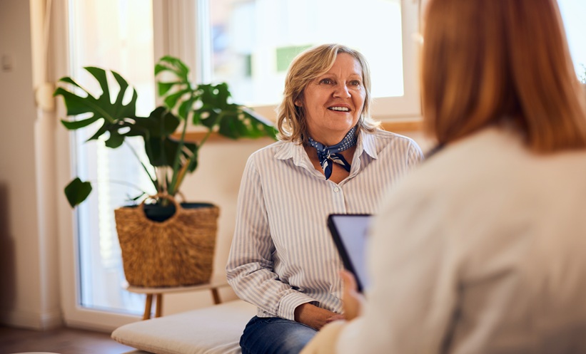 Doctor discussing hidradenitis suppurativa care with a patient during a clinical consultation.