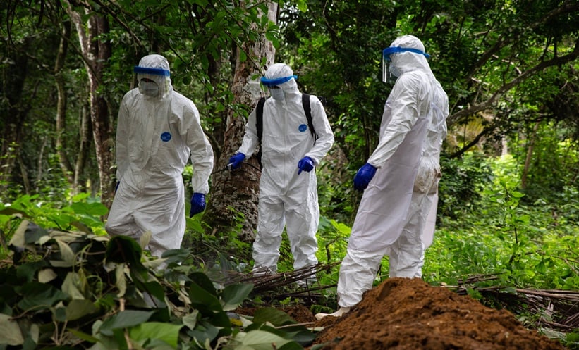 Healthcare workers in hazmat suits
