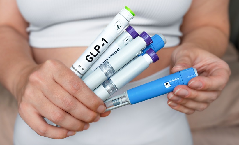 person holding injectable medications