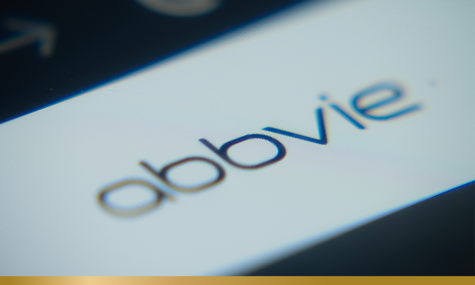 A Close-up of a laptop screen is displaying the AbbVie web interface in a browser.
