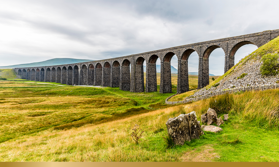 A panorama view of the Ribblehead Viaduct, Yorkshire, UK in summertime
