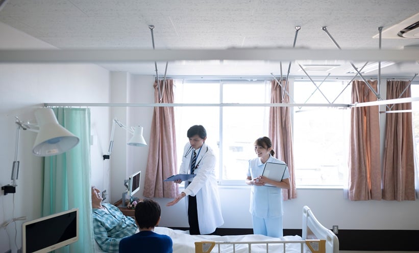 Physician discussing respiratory virus vaccines with a patient during a clinical consultation