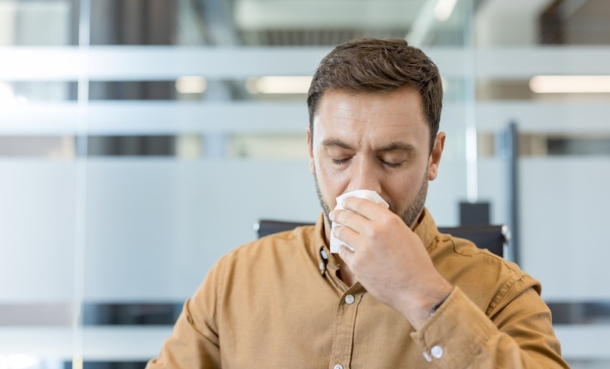 Person blowing his nose