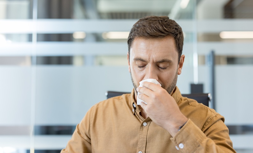 Person blowing his nose