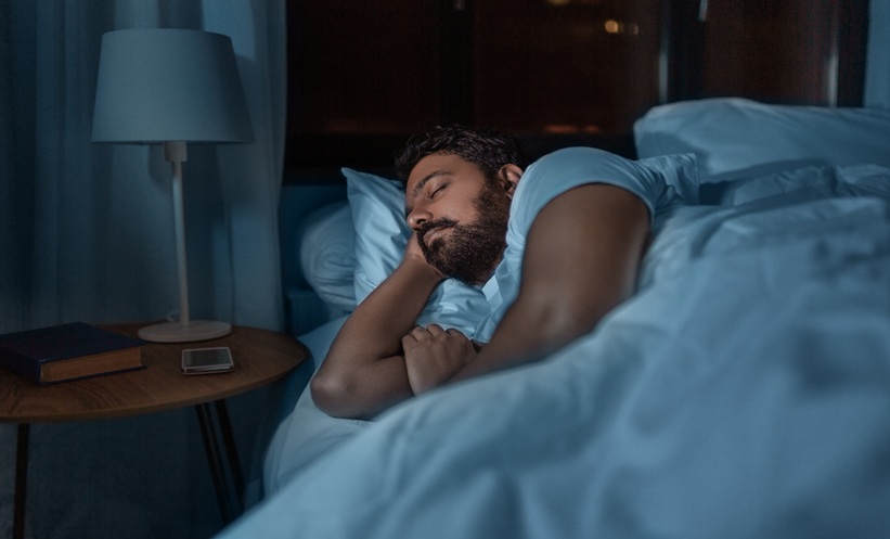 Person sleeping in bed